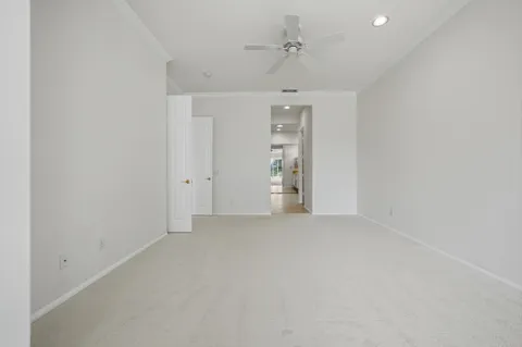 a bathroom with a sink double vanity granite tub shower and a mirror