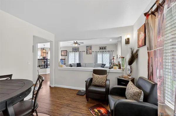a living room with furniture or couch and a wooden floor