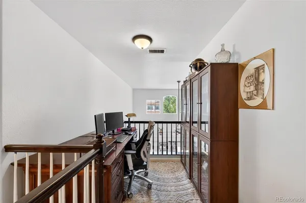 a view of a hallway with workspace