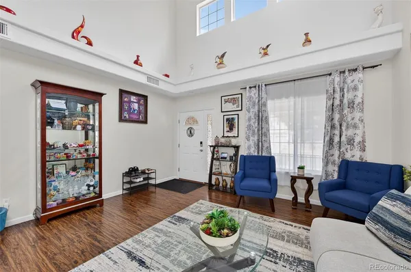 a living room with furniture and a rug