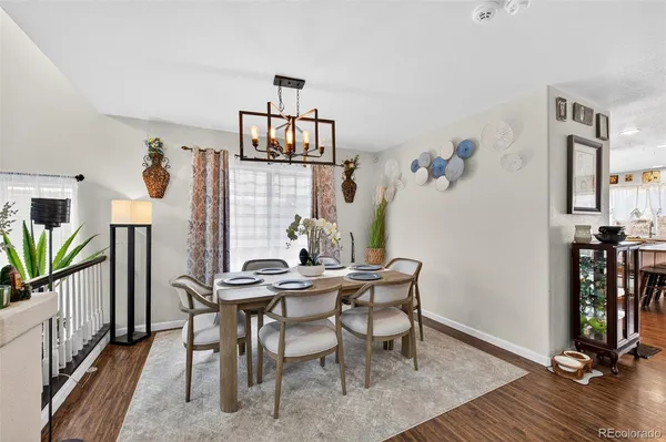 a view of a dining room with furniture and wooden floor