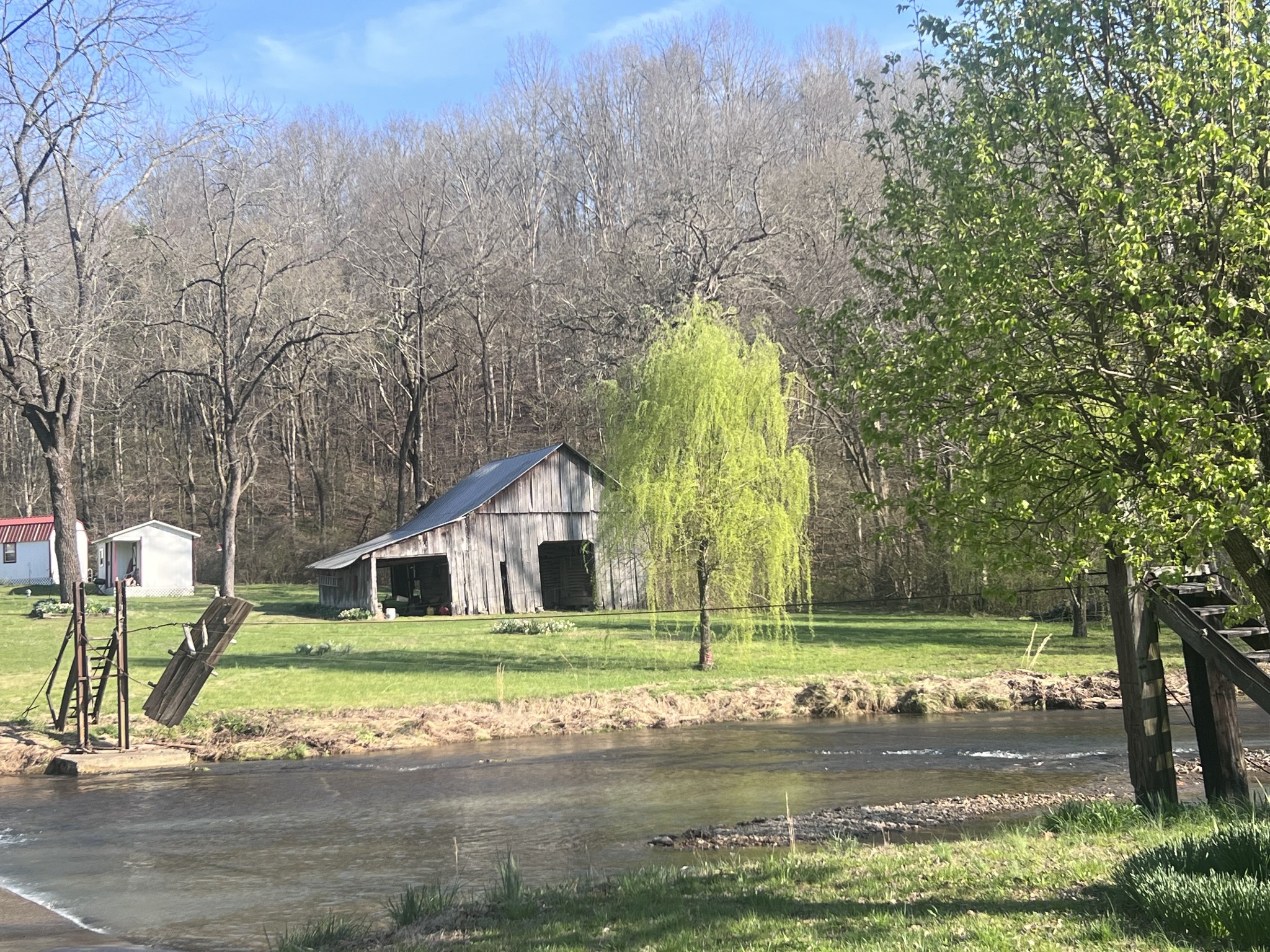 285 Spring Creek Road Lawrenceburg, TN 38464 - Photo 2 of 45 a view of a house with a backyard