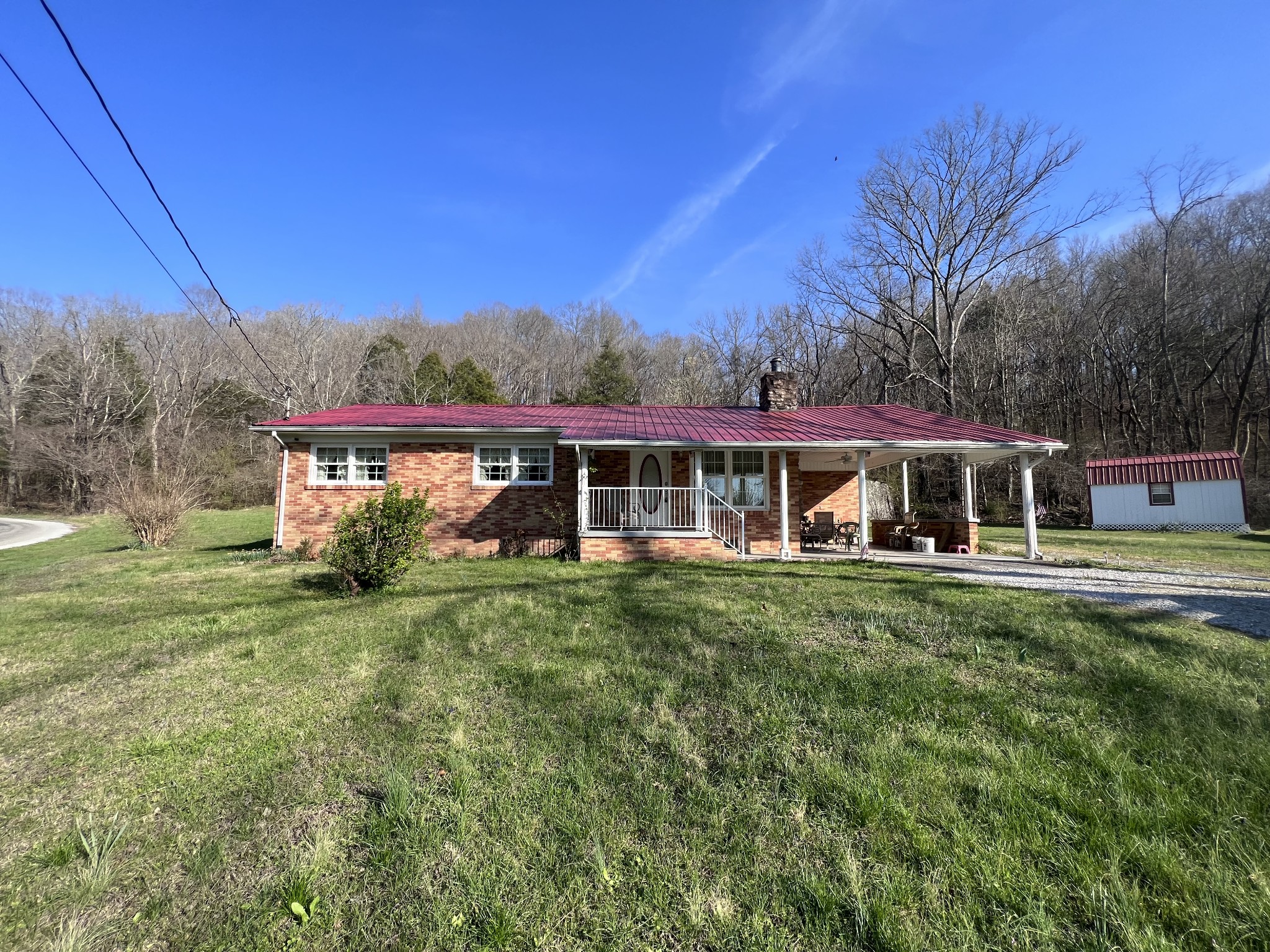 285 Spring Creek Road Lawrenceburg, TN 38464 - Photo 25 of 45 a front view of a house with a yard
