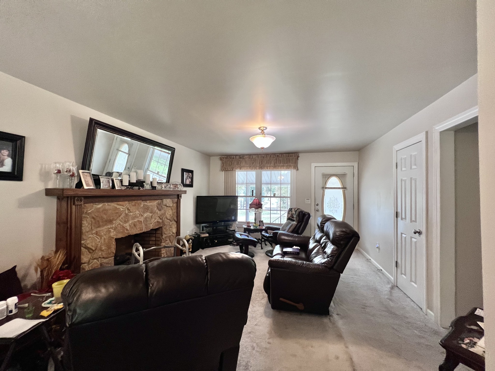 285 Spring Creek Road Lawrenceburg, TN 38464 - Photo 32 of 45 a living room with furniture and a fireplace