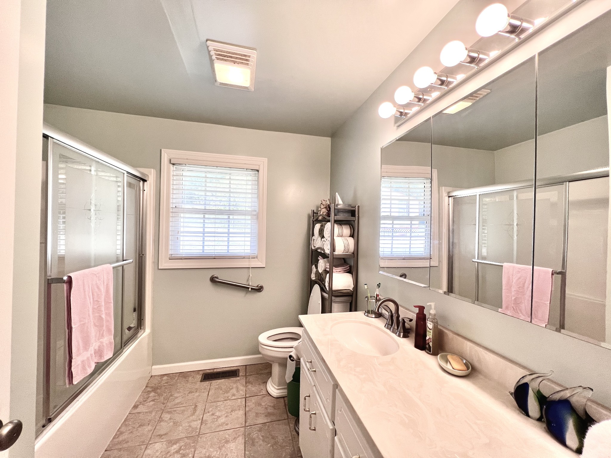 285 Spring Creek Road Lawrenceburg, TN 38464 - Photo 38 of 45 a bathroom with a double vanity sink mirror and toilet