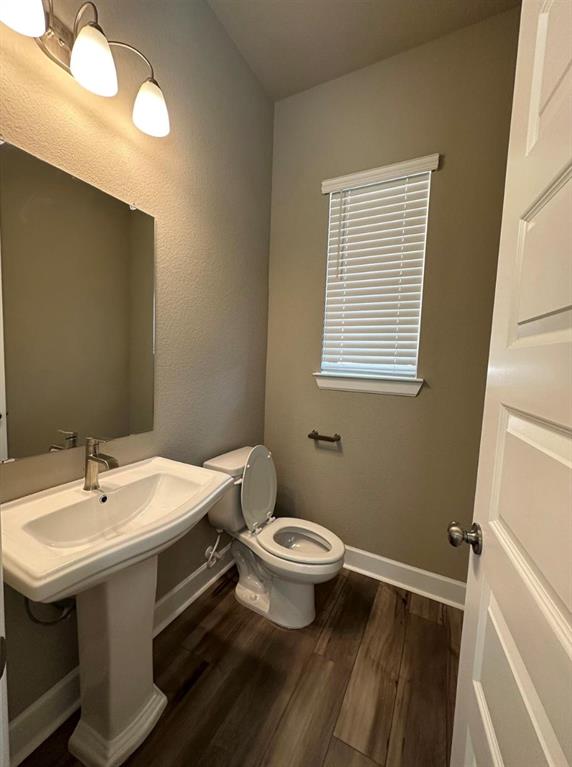2525 Four Roses Drive Lewisville, TX 75056 - Photo 3 of 19 a bathroom with a sink and a toilet