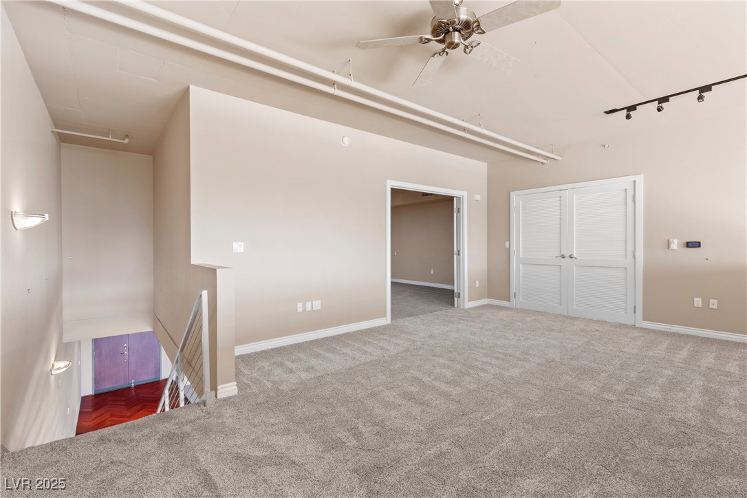 360 East Desert Inn Road, Unit 605 Las Vegas, NV 89109 - Photo 27 of 43 Sitting room featuring carpet flooring, a ceiling fan, and a closet