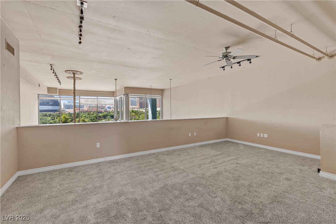 360 East Desert Inn Road, Unit 605 Las Vegas, NV 89109 - Photo 29 of 43 Sitting room featuring light colored carpet and a ceiling fan