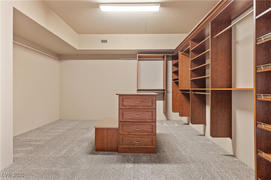 360 East Desert Inn Road, Unit 605 Las Vegas, NV 89109 - Photo 31 of 43 Spacious closet with light colored carpet