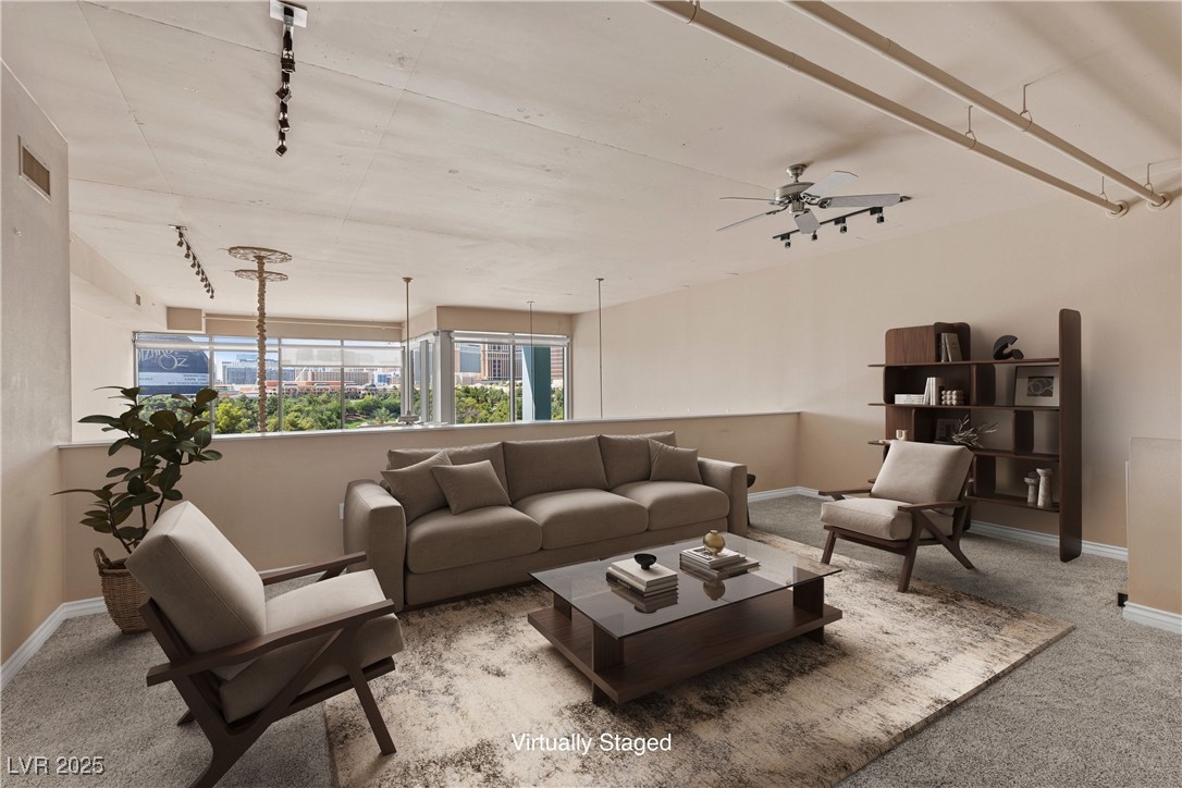 360 East Desert Inn Road, Unit 605 Las Vegas, NV 89109 - Photo 4 of 43 Virtually staged | upstairs sitting room with carpet, ceiling fan, and track lighting