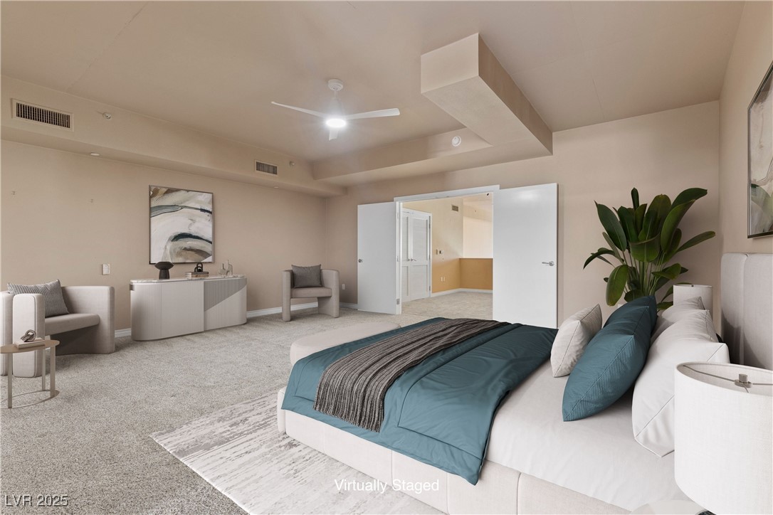 360 East Desert Inn Road, Unit 605 Las Vegas, NV 89109 - Photo 5 of 43 Virtually staged | upstairs carpeted primary bedroom with ceiling fan and connected bathroom