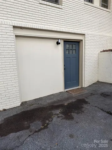 a view of hallway with wooden floor