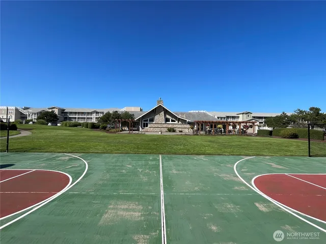 a front view of a building with a garden