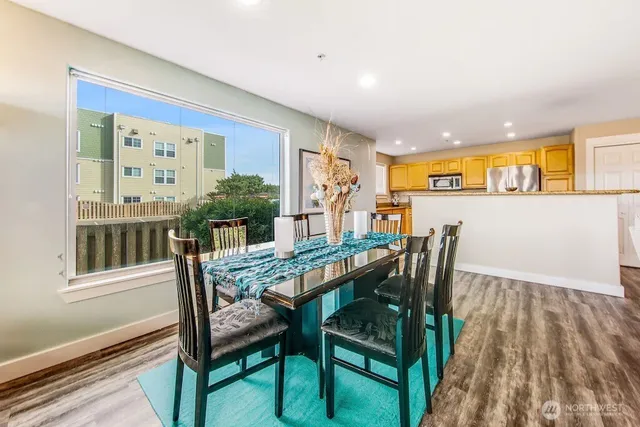 a view of a dining room with furniture and window