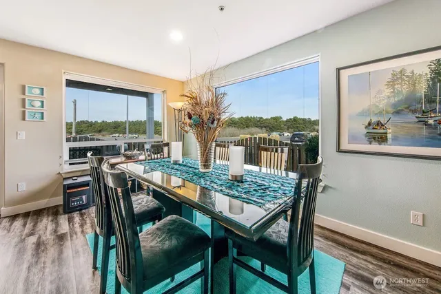 a view of a dining room with furniture window and wooden floor