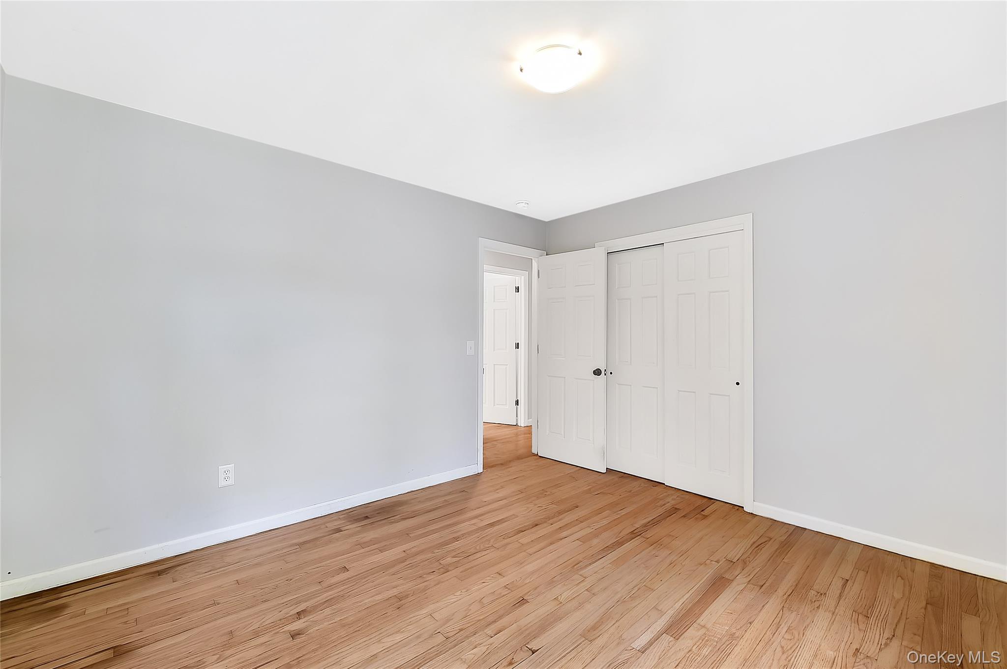 18 Stage Road Pine Island, NY 10969 - Photo 11 of 17 a view of an empty room with wooden floor