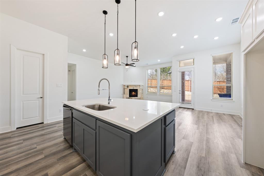 1606 Bulls Eye Road Mansfield, TX 76063 - Photo 11 of 27 a kitchen with a sink and stove