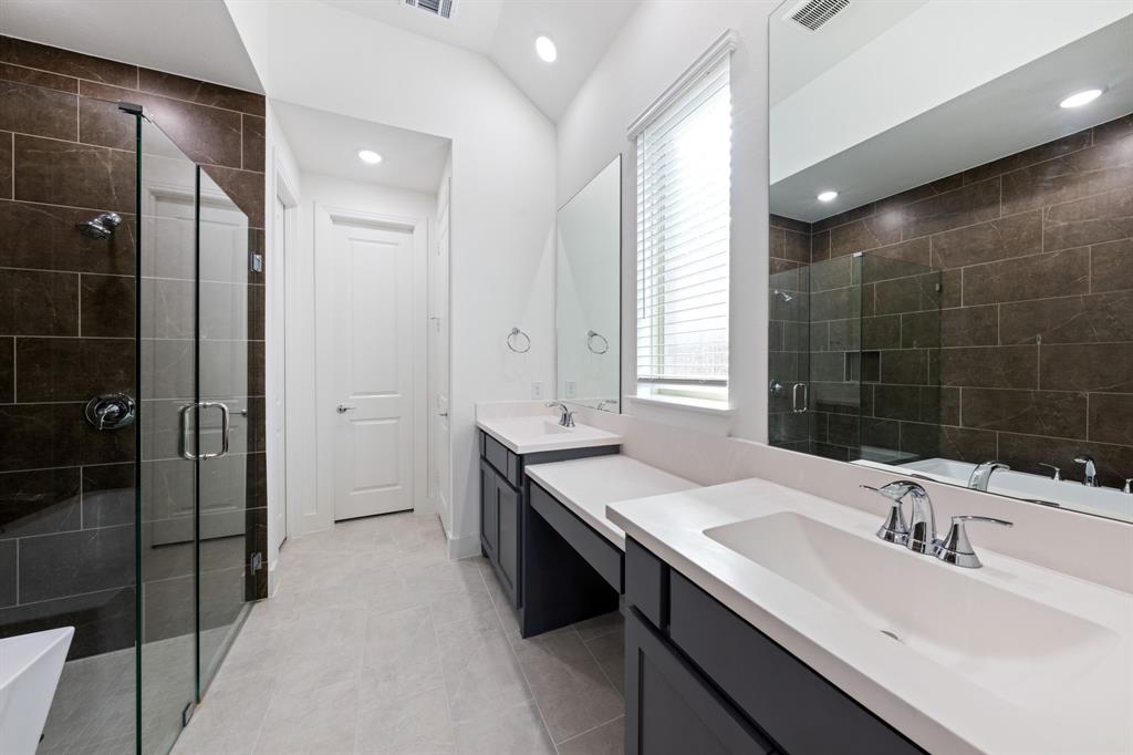 1606 Bulls Eye Road Mansfield, TX 76063 - Photo 16 of 27 a bathroom with a double vanity sink mirror and shower