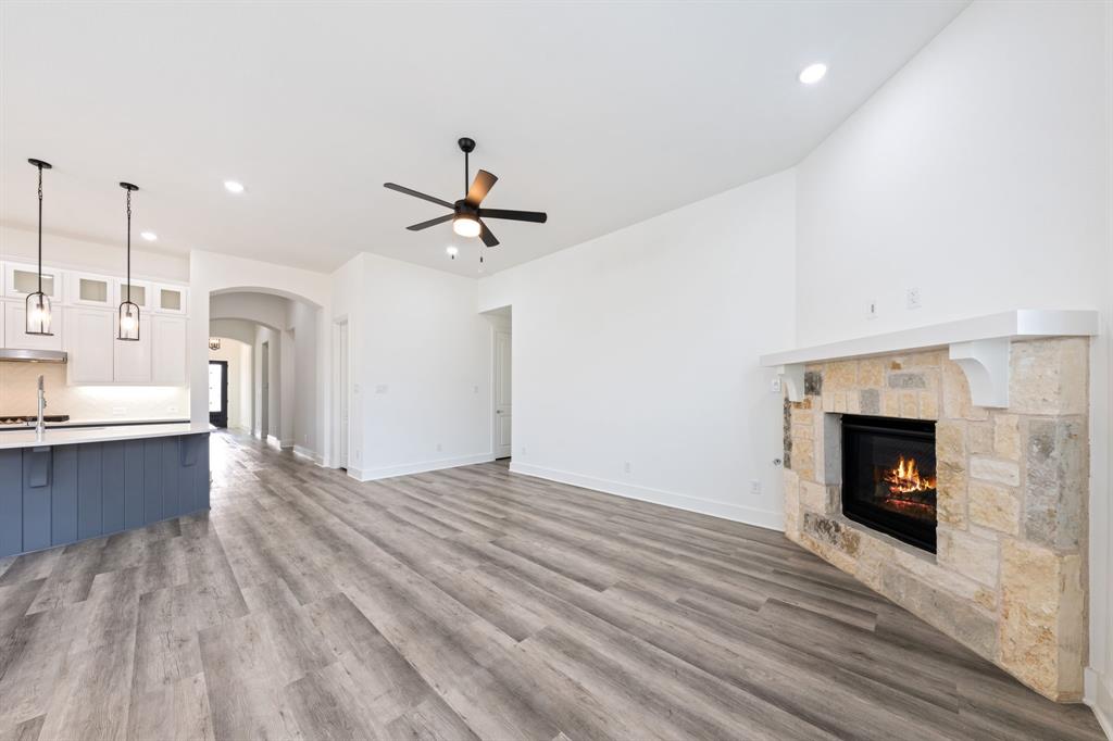1606 Bulls Eye Road Mansfield, TX 76063 - Photo 5 of 27 a view of a kitchen with a sink and a fireplace