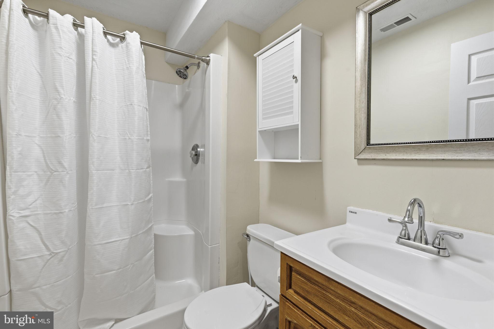 2801 Profitt Path Edgewood, MD 21040 - Photo 22 of 32 a bathroom with a sink toilet and shower