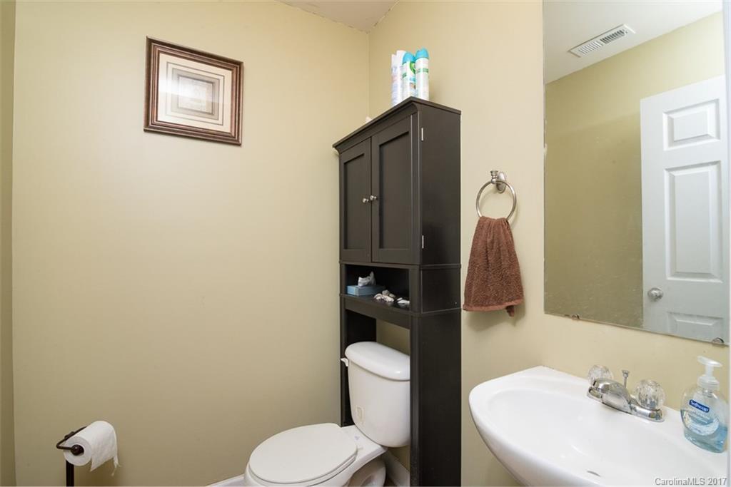 982 Ramsgate Drive Southwest Concord, NC 28025 - Photo 11 of 22 a bathroom with a toilet sink and mirror