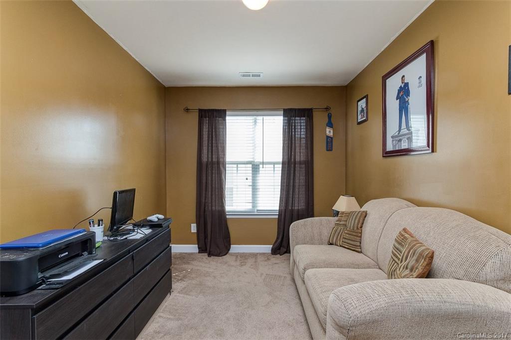 982 Ramsgate Drive Southwest Concord, NC 28025 - Photo 12 of 22 a living room with furniture and a window
