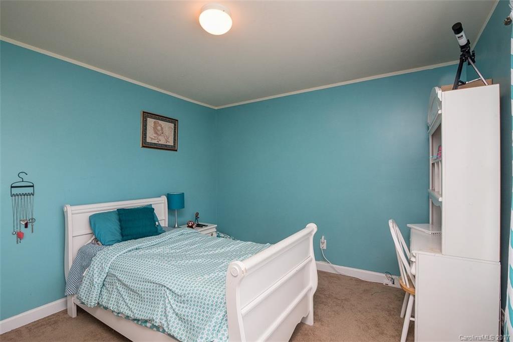 982 Ramsgate Drive Southwest Concord, NC 28025 - Photo 17 of 22 a bedroom with a bed and a window
