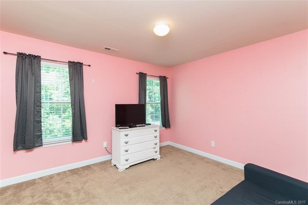 982 Ramsgate Drive Southwest Concord, NC 28025 - Photo 18 of 22 a room with furniture and flat screen tv