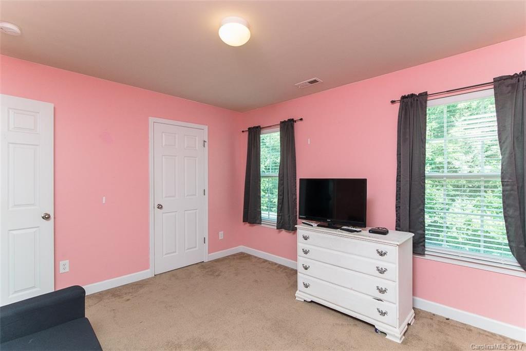 982 Ramsgate Drive Southwest Concord, NC 28025 - Photo 19 of 22 a living room with flat screen tv