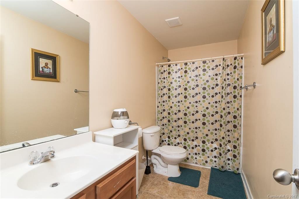 982 Ramsgate Drive Southwest Concord, NC 28025 - Photo 20 of 22 a bathroom with a sink toilet and shower