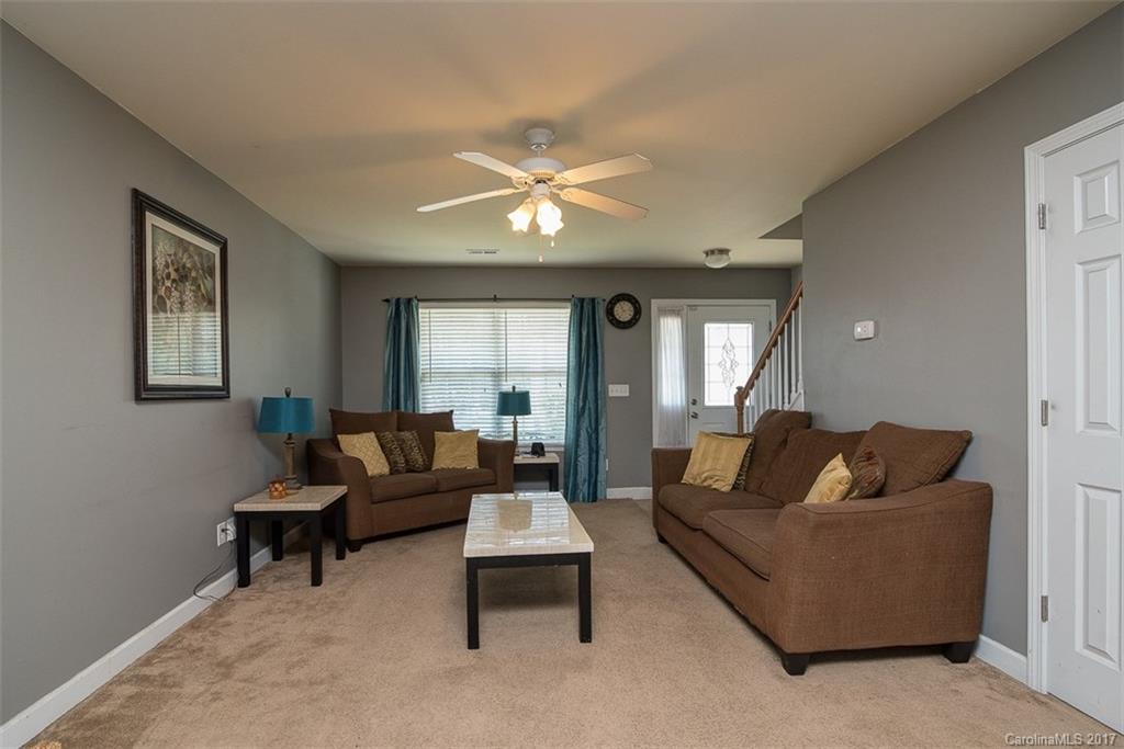 982 Ramsgate Drive Southwest Concord, NC 28025 - Photo 5 of 22 a living room with furniture and a large window
