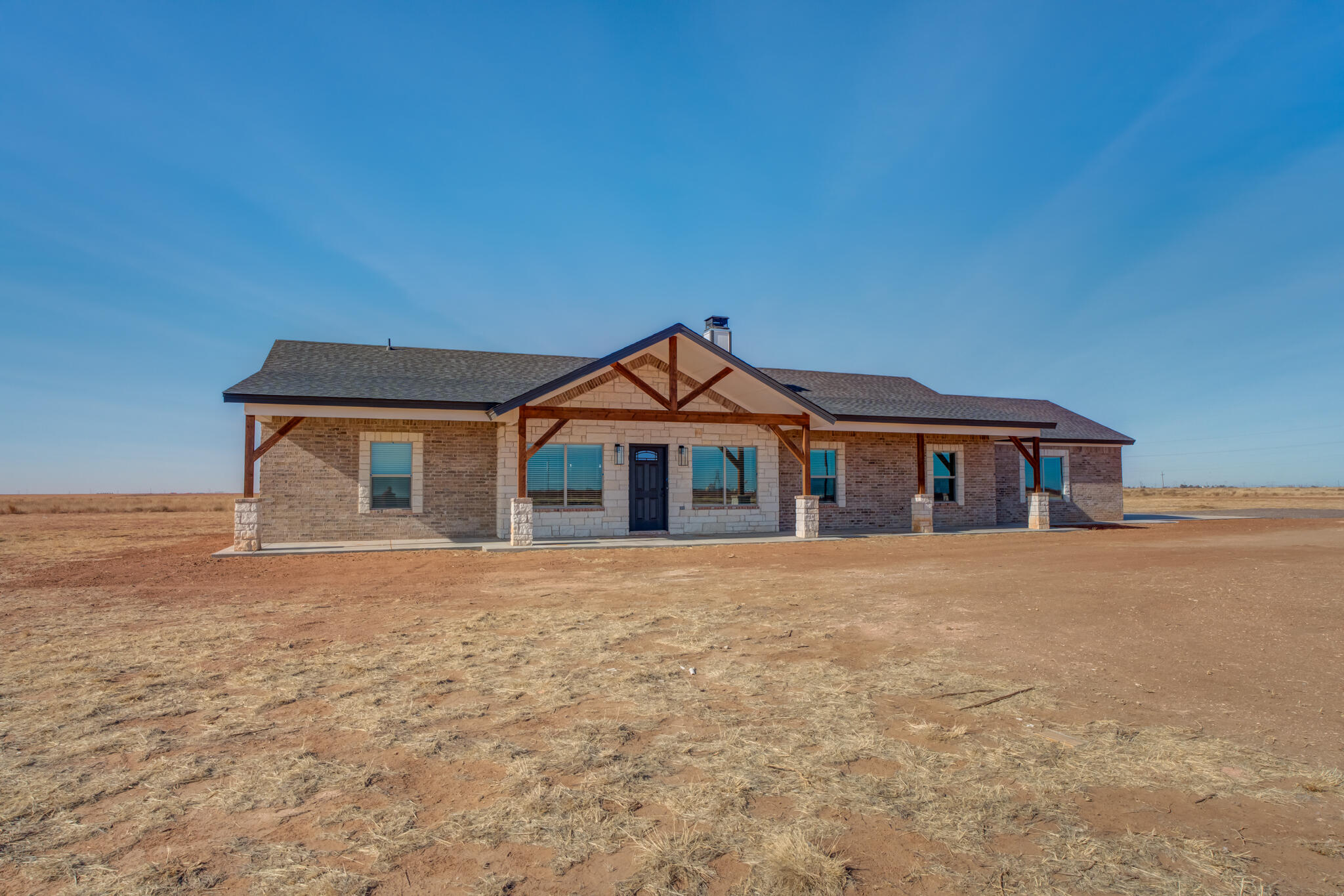 12401 North C R 2900 Lubbock, TX 79403 - Photo 2 of 40 a front view of a house with yard