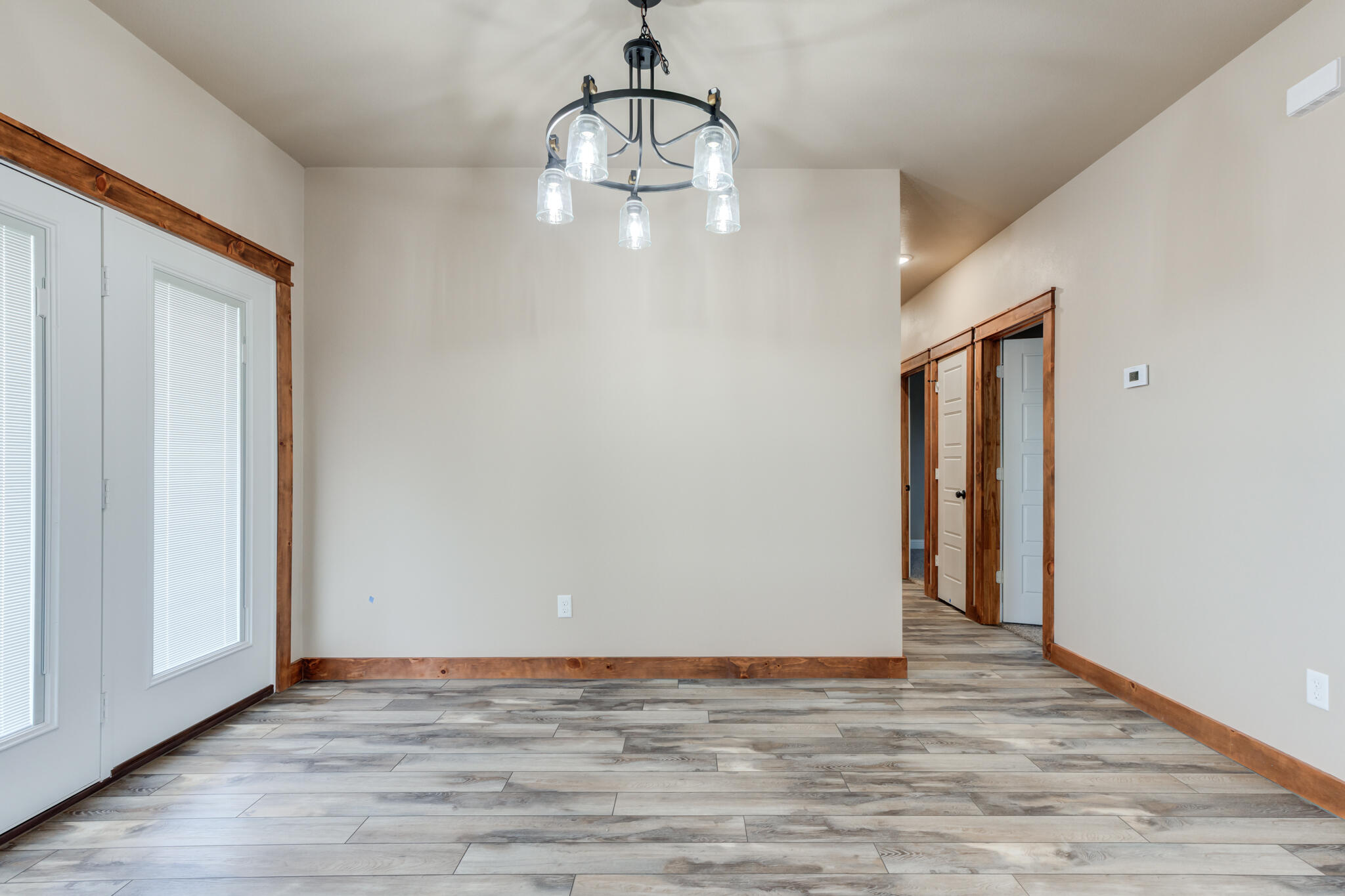 12401 North C R 2900 Lubbock, TX 79403 - Photo 21 of 40 a view of empty room with wooden floor and window