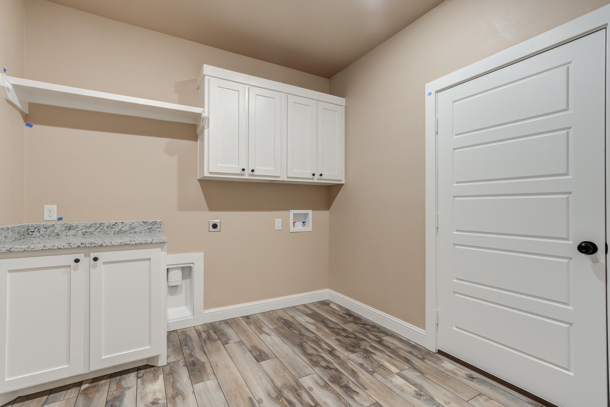 12401 North C R 2900 Lubbock, TX 79403 - Photo 26 of 40 a view of cabinets and wooden floor