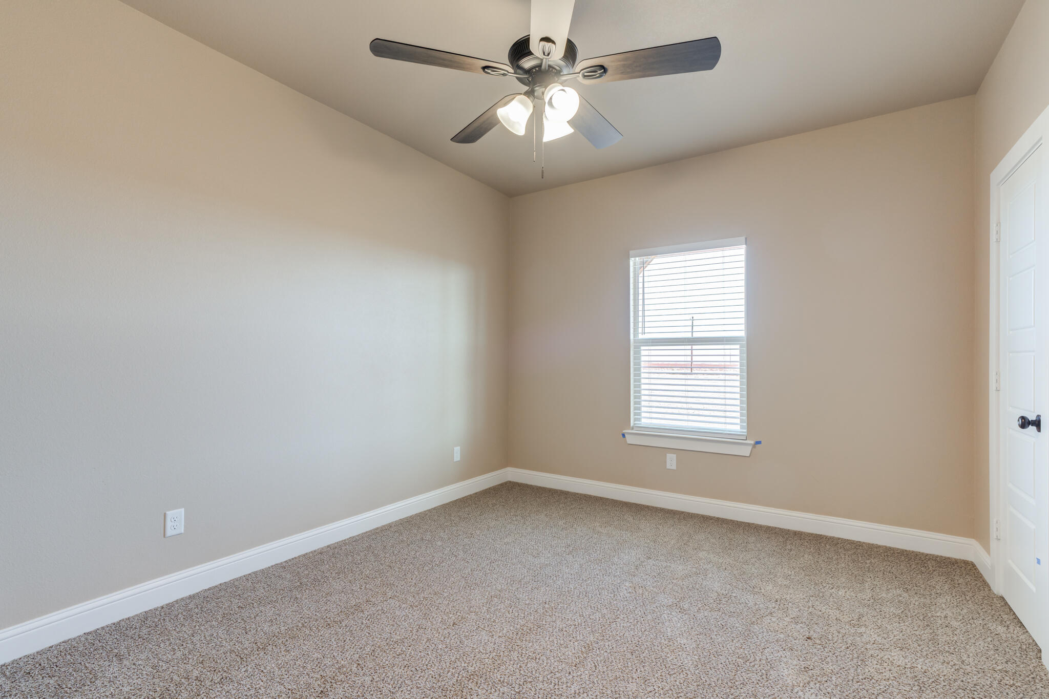 12401 North C R 2900 Lubbock, TX 79403 - Photo 28 of 40 an empty room with a window and a fan