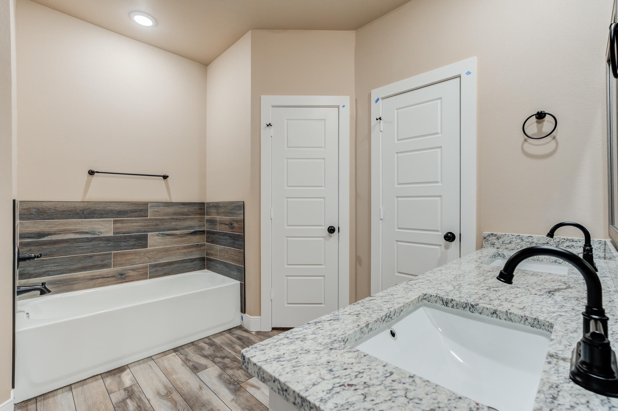12401 North C R 2900 Lubbock, TX 79403 - Photo 35 of 40 a bathroom with a bathtub and a sink