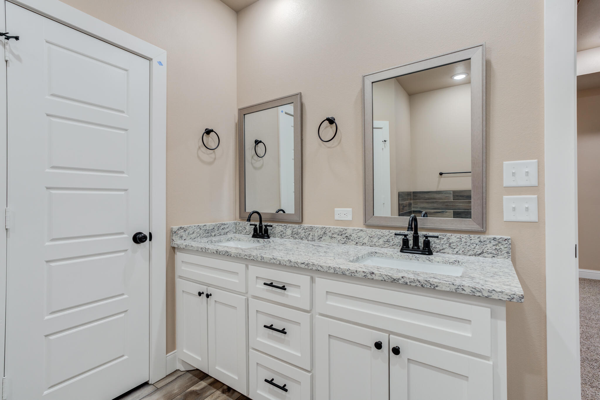 12401 North C R 2900 Lubbock, TX 79403 - Photo 36 of 40 a bathroom with a granite countertop sink vanity and mirror