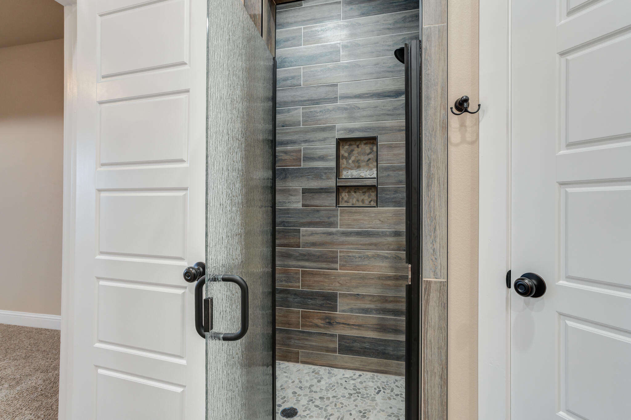 12401 North C R 2900 Lubbock, TX 79403 - Photo 37 of 40 a bathroom with a glass shower door