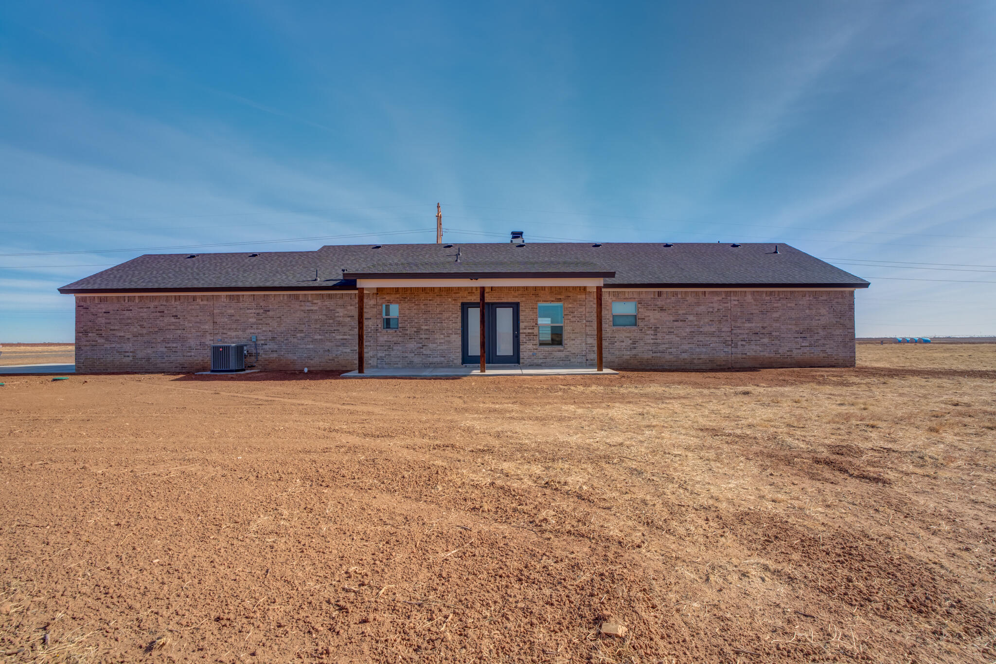 12401 North C R 2900 Lubbock, TX 79403 - Photo 40 of 40 a front view of a house with a yard