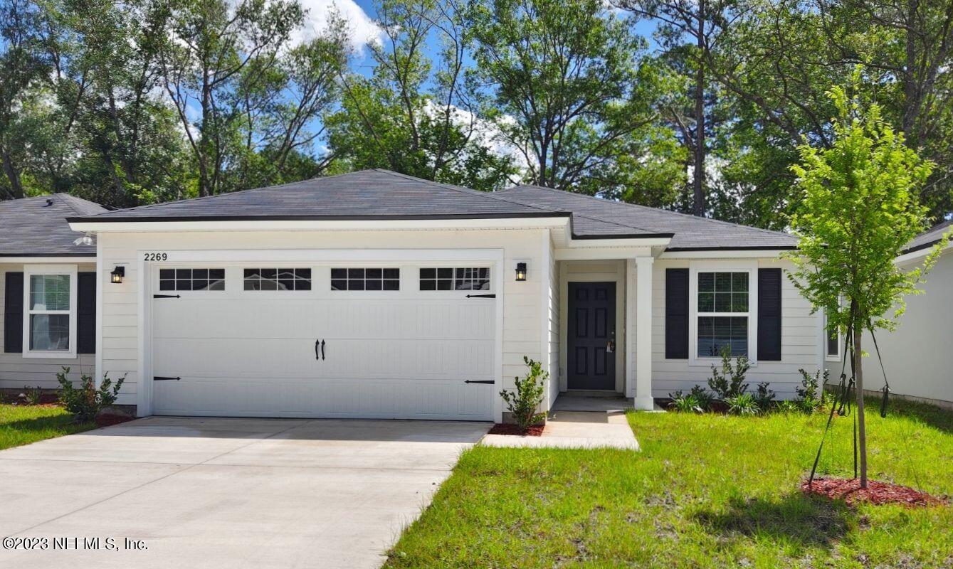 a view of a house with a garden