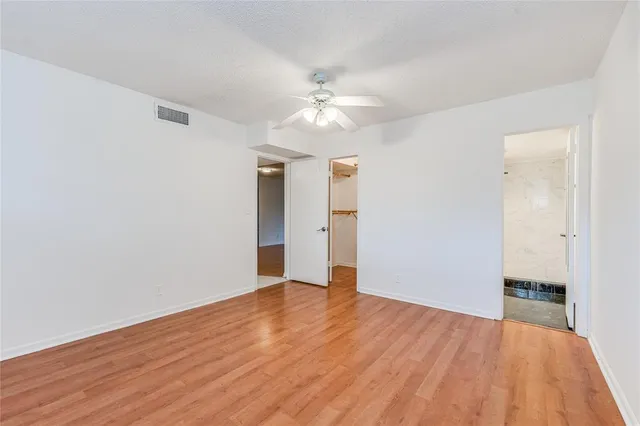 a kitchen with granite countertop a refrigerator and a sink