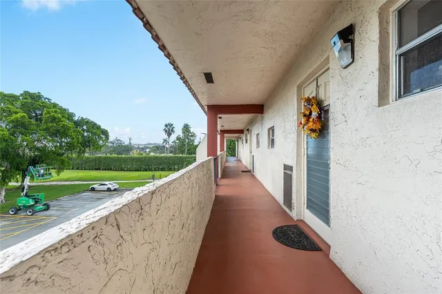 a view of a hallway with a door