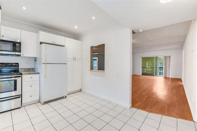 a bathroom with a sink a toilet a mirror and shower
