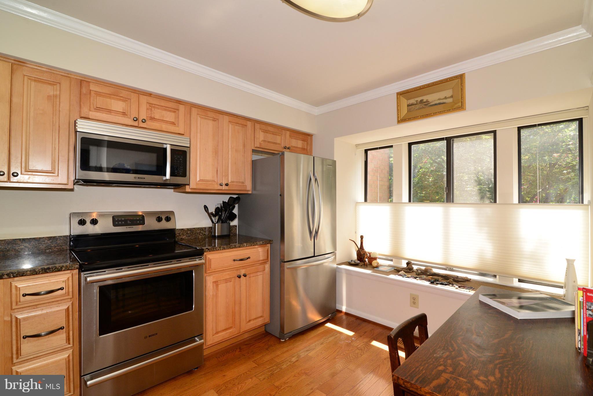 2048 Swans Neck Way Reston, VA 20191 - Photo 3 of 22 Kitchen with upgraded cabinetry and appliances.