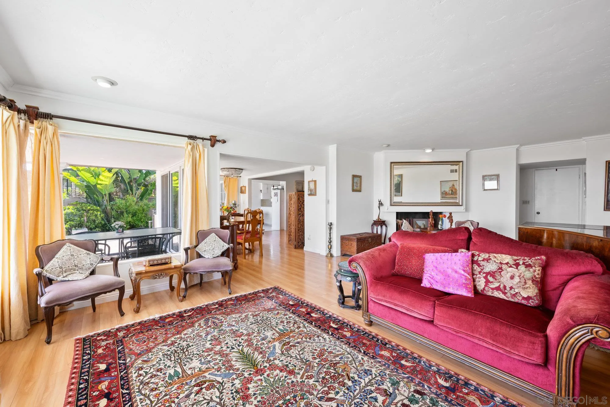5903 Soledad Mountain Road La Jolla, CA 92037 - Photo 13 of 44 a living room with furniture red rug and a large window