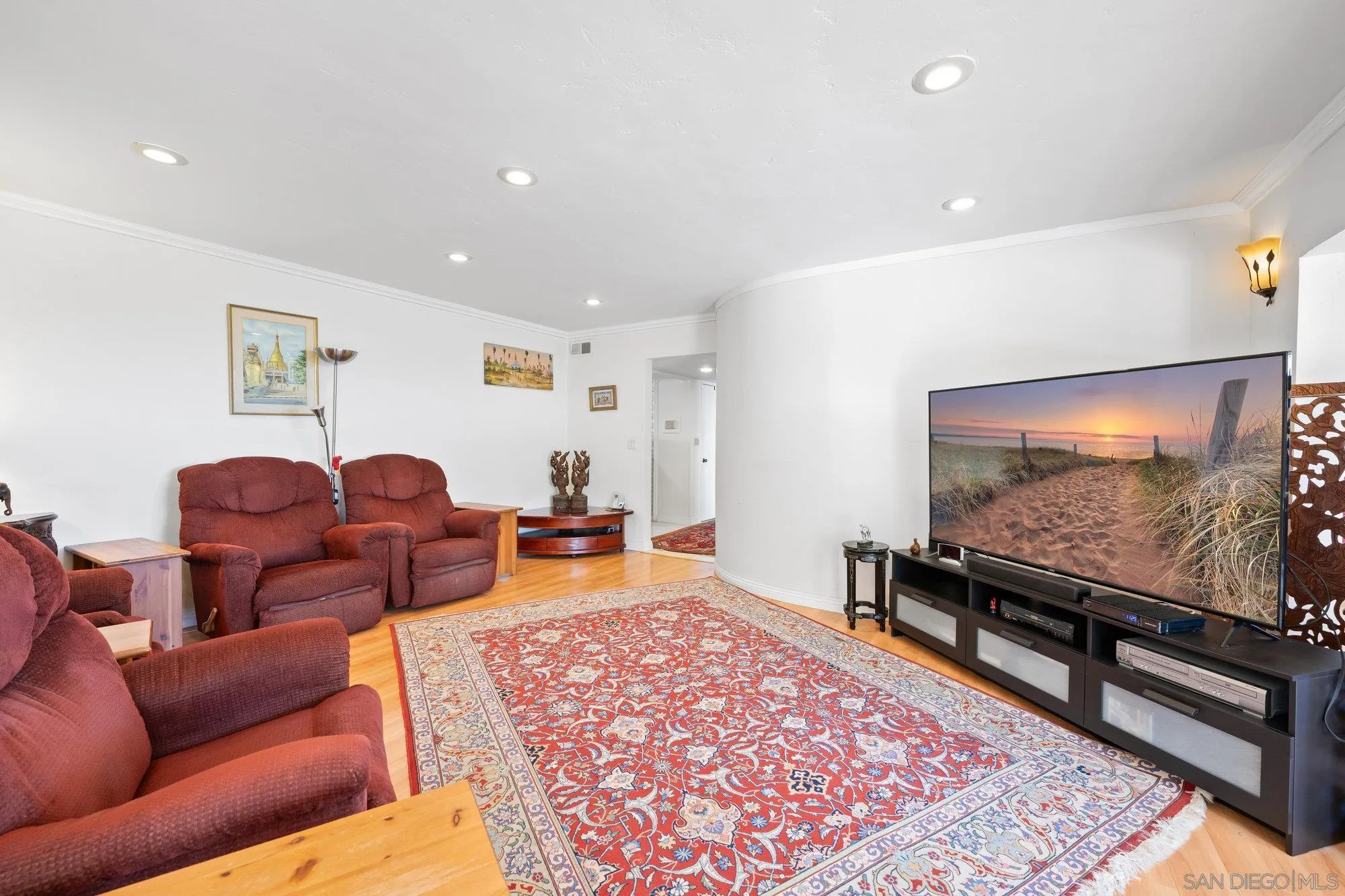 5903 Soledad Mountain Road La Jolla, CA 92037 - Photo 16 of 44 a living room with furniture and a flat screen tv
