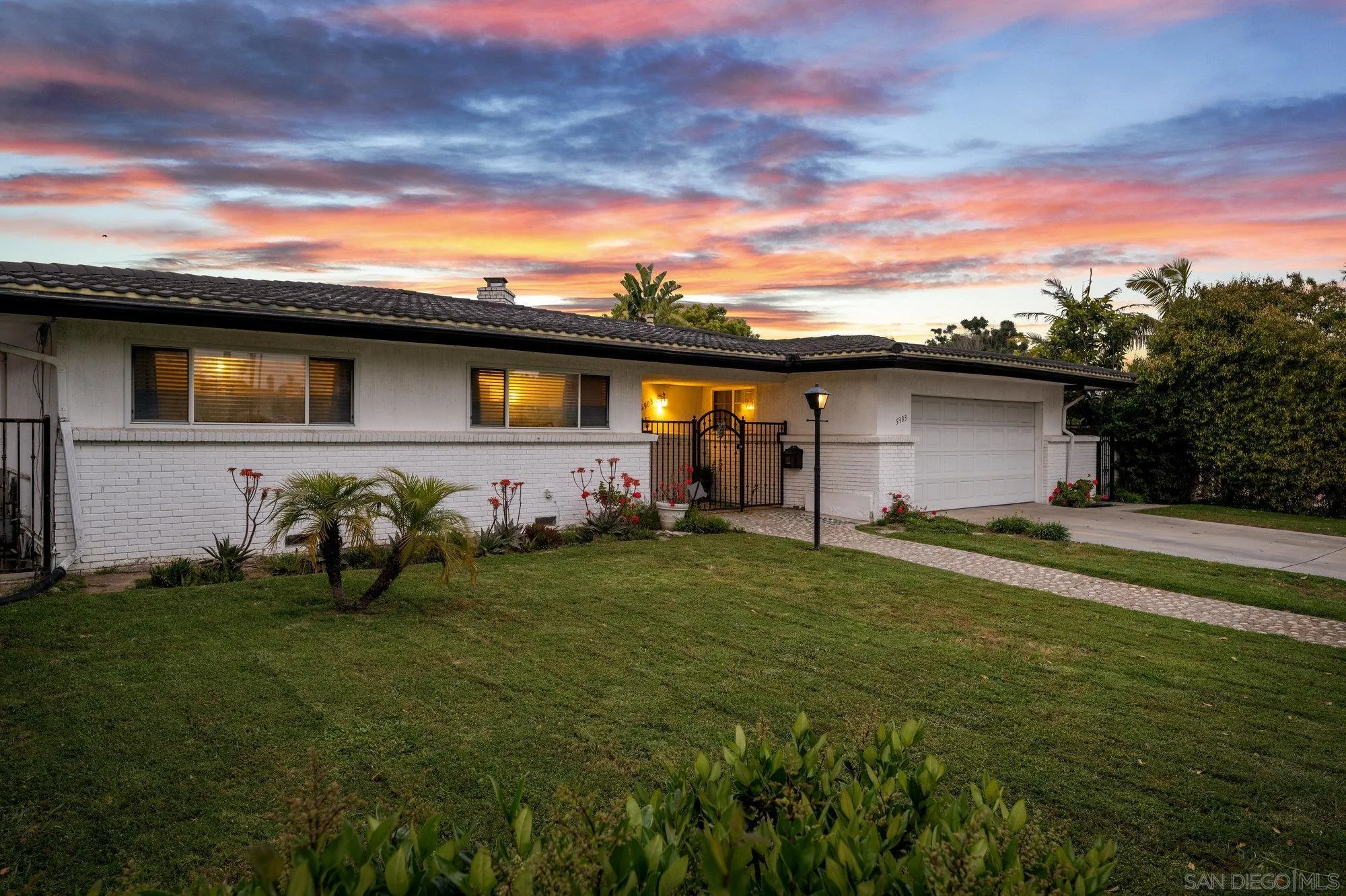 5903 Soledad Mountain Road La Jolla, CA 92037 - Photo 2 of 44 a backyard of a house with lots of green space