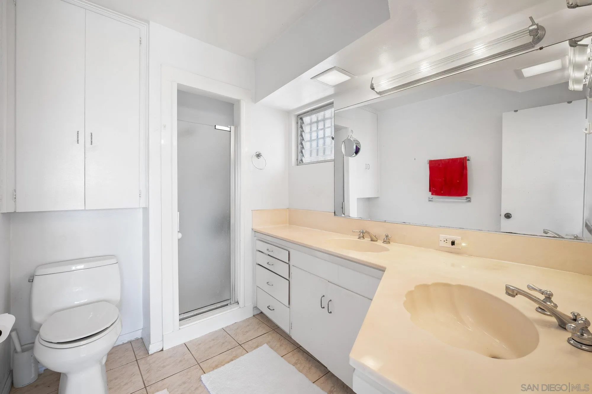 5903 Soledad Mountain Road La Jolla, CA 92037 - Photo 26 of 44 a bathroom with a sink and a toilet