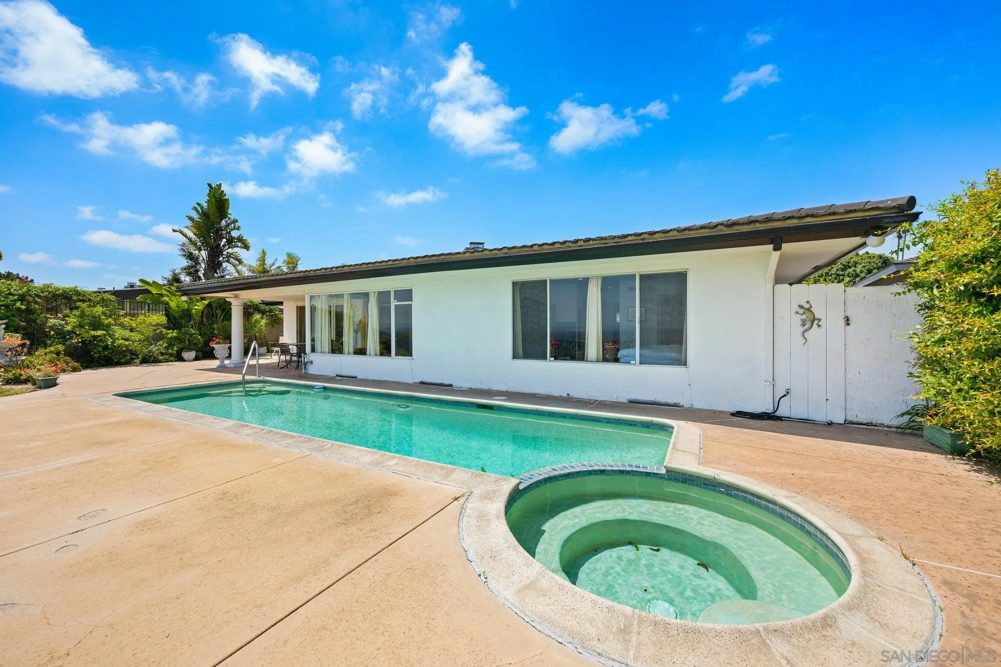 5903 Soledad Mountain Road La Jolla, CA 92037 - Photo 34 of 44 a view of backyard with swimming pool and outdoor seating