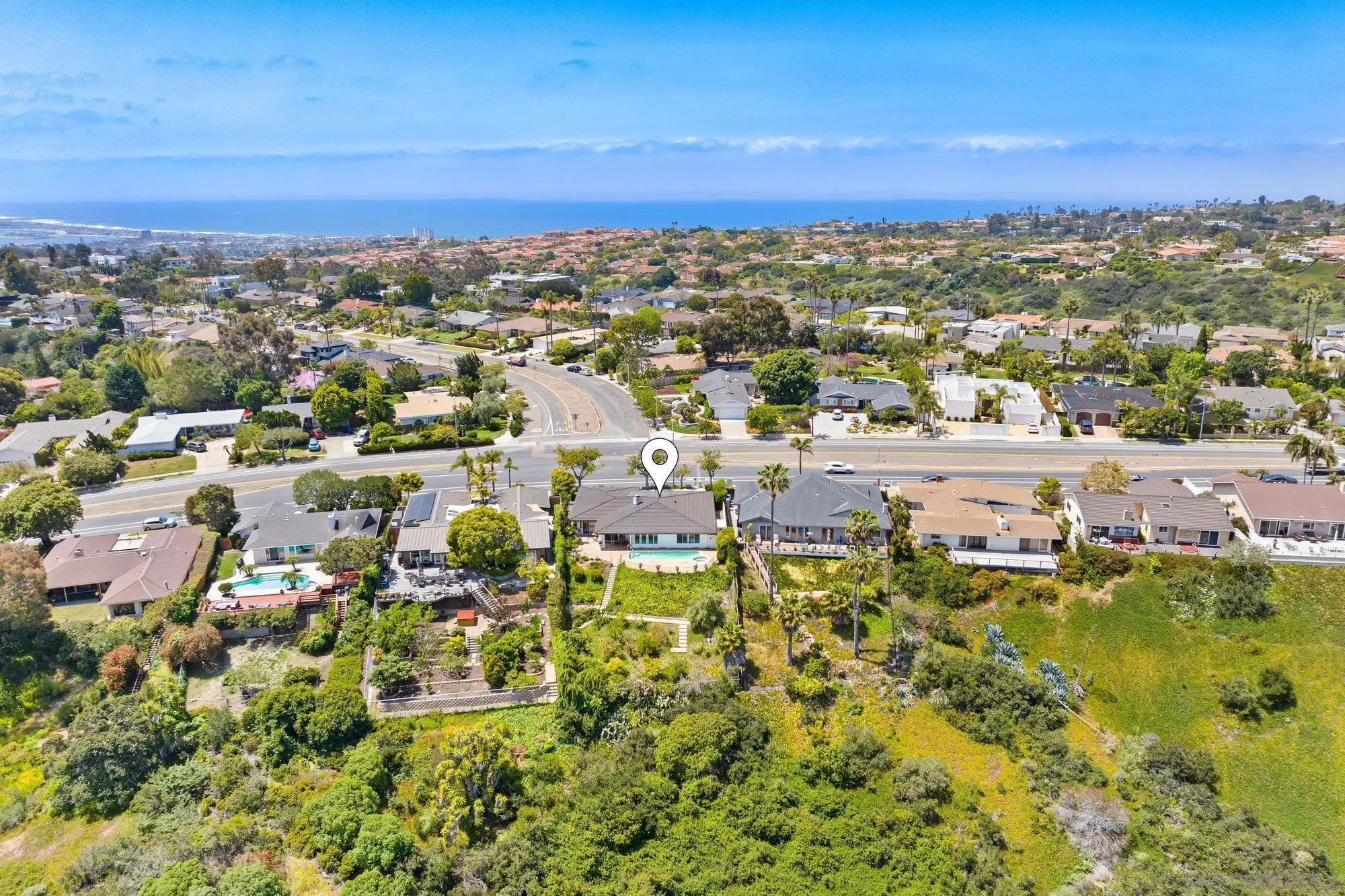 5903 Soledad Mountain Road La Jolla, CA 92037 - Photo 35 of 44 an aerial view of a city with lots of residential buildings ocean and mountain view in back
